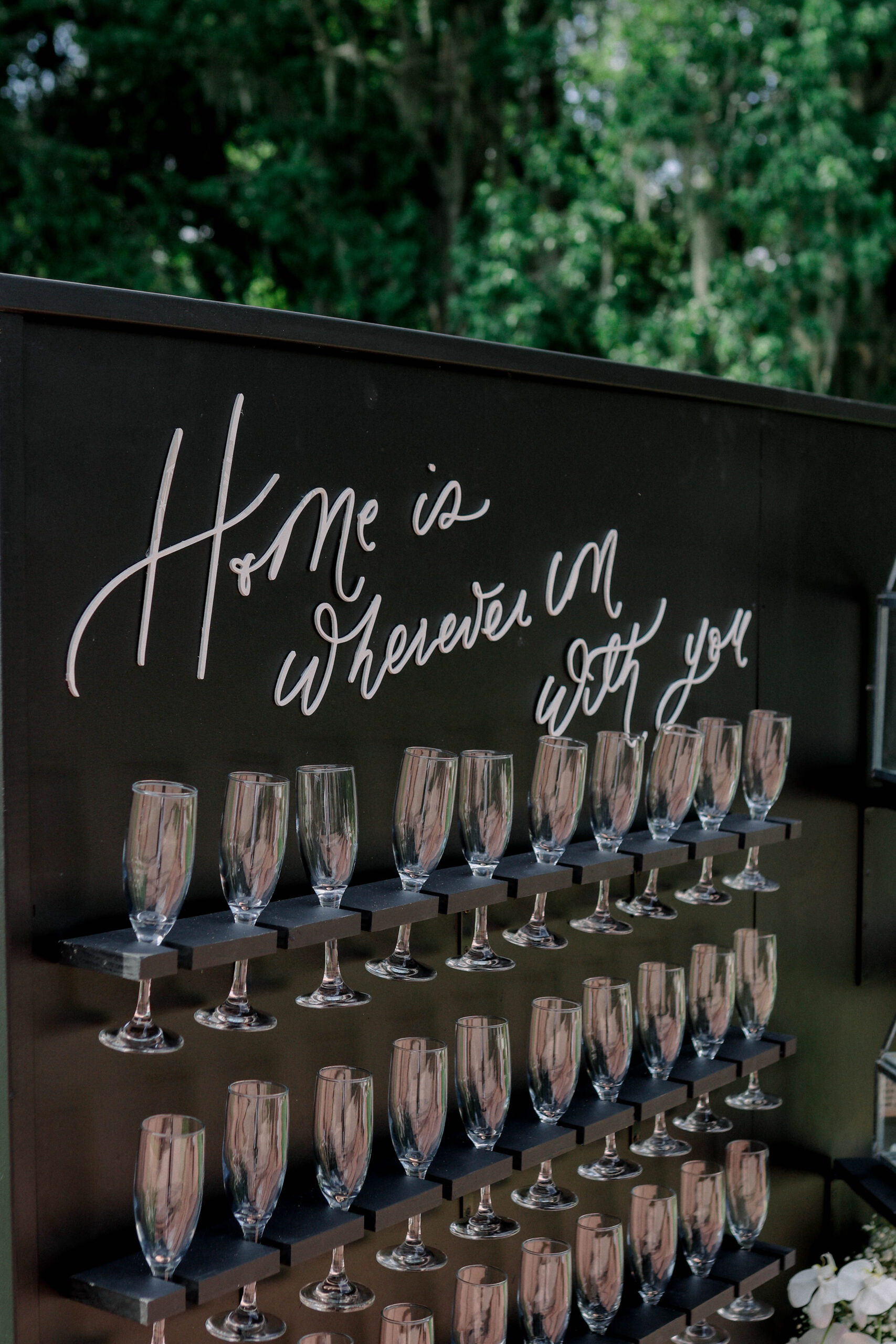 Champagne wall for wedding that says "Home is wherever I'm with you"