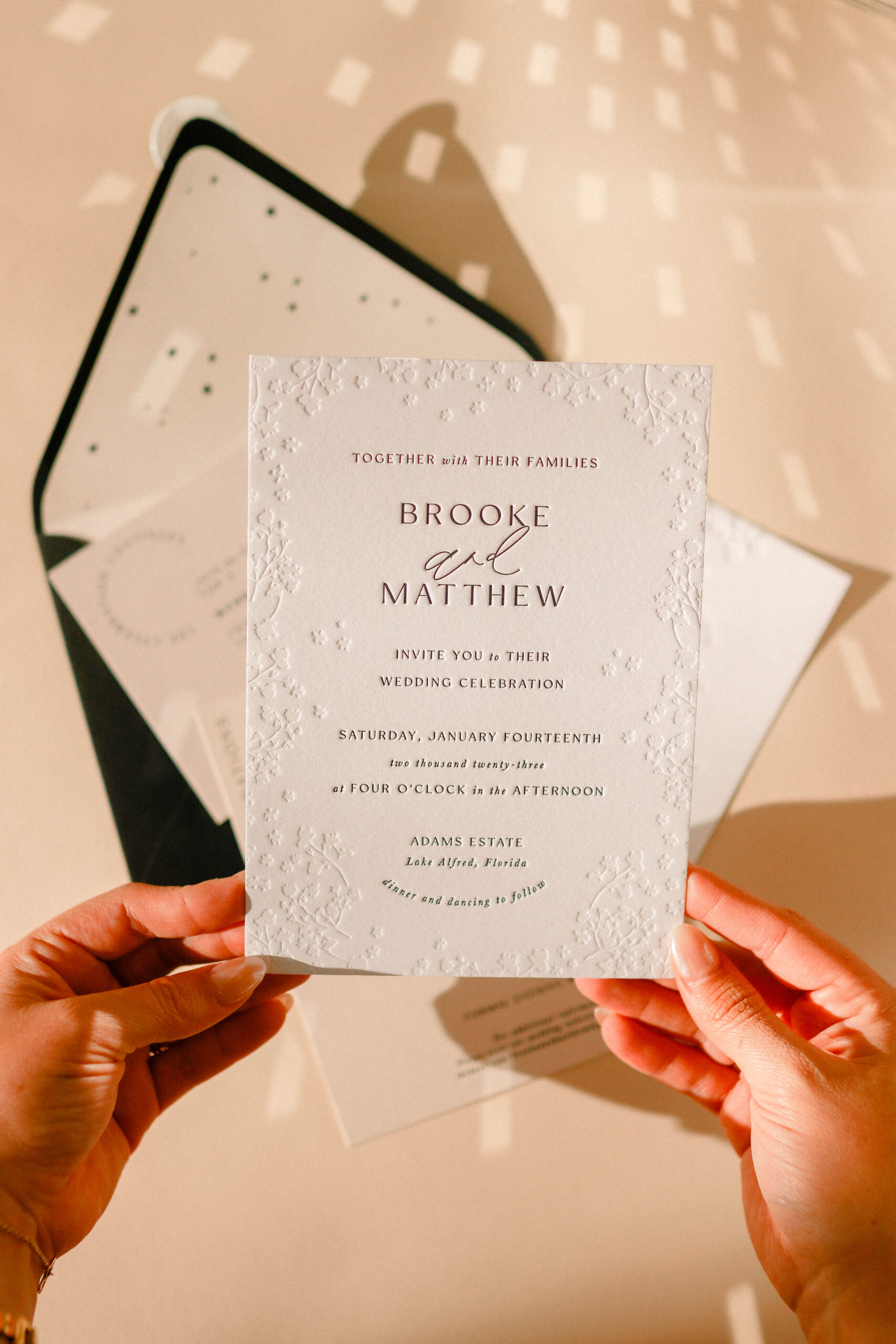 Black, white and taupe wedding invitation suite