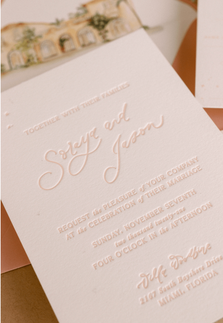 Letterpress printing on pink wedding invitation
