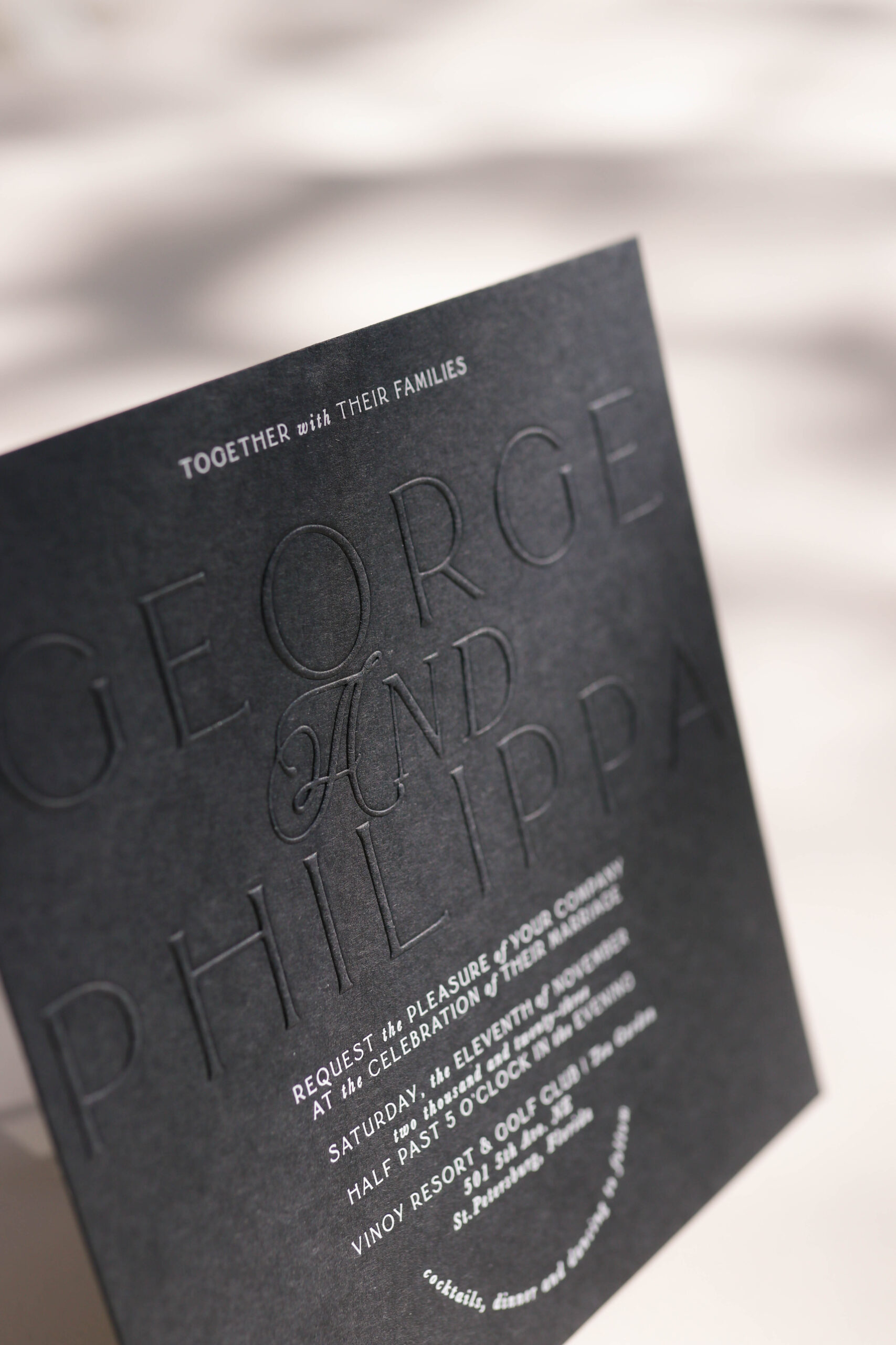 debossed wedding invitation with white foil